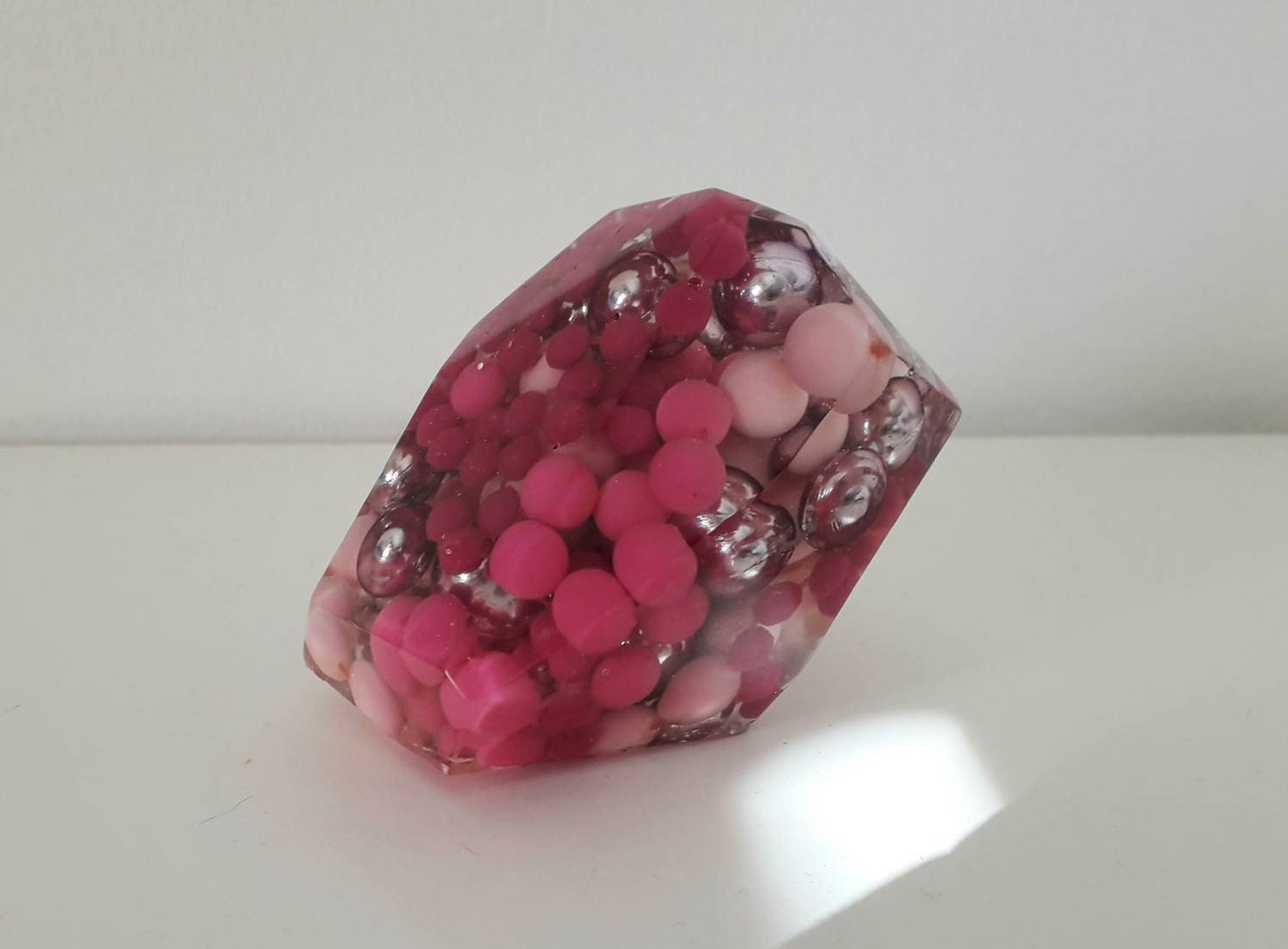 Hand made epoxy resin gem shaped paperweight inlaid with vintage pink beads