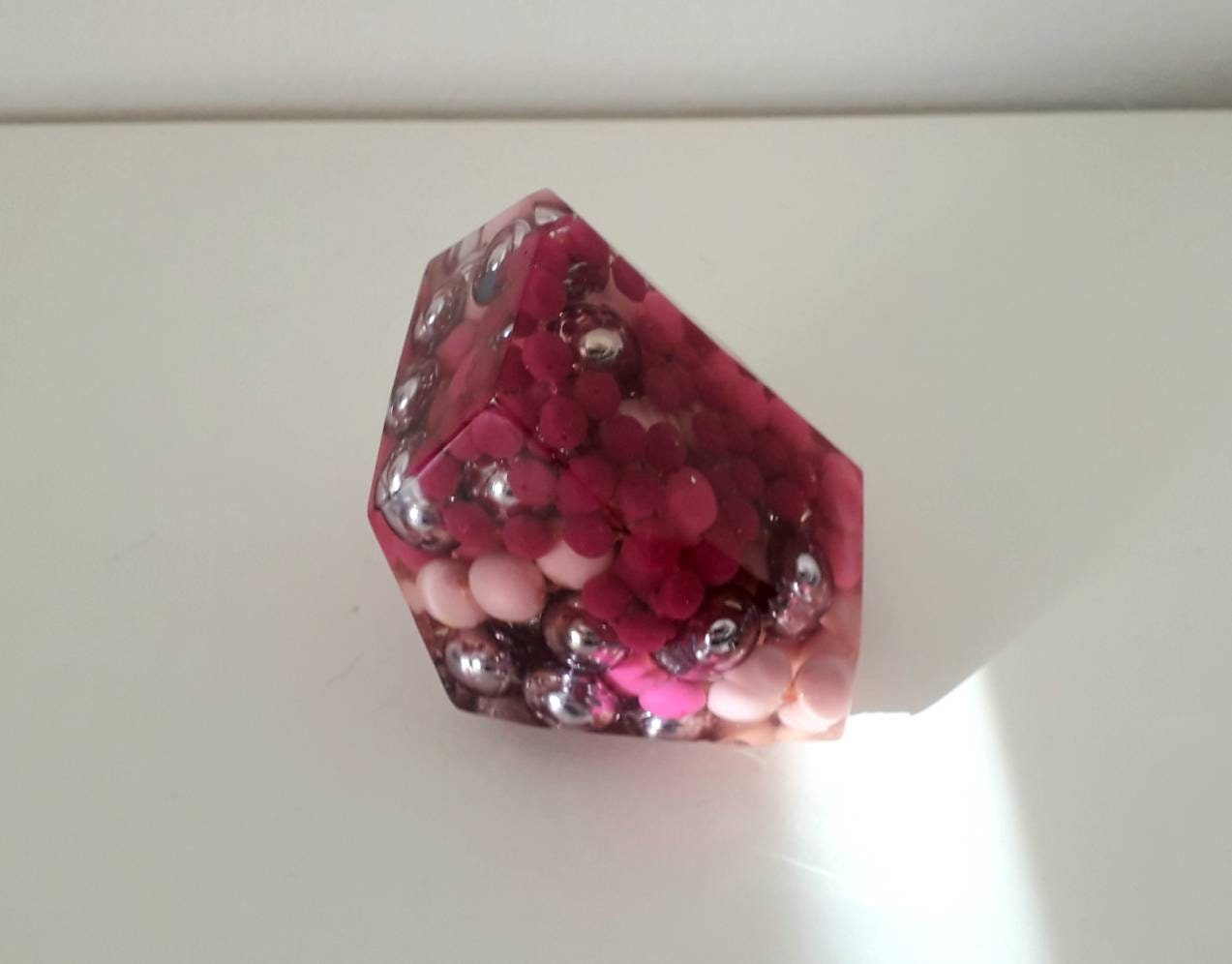 Hand made epoxy resin gem shaped paperweight inlaid with vintage pink beads