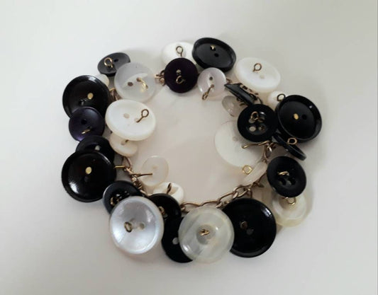 Hand made goldtone and monochrome vintage button charm bracelet