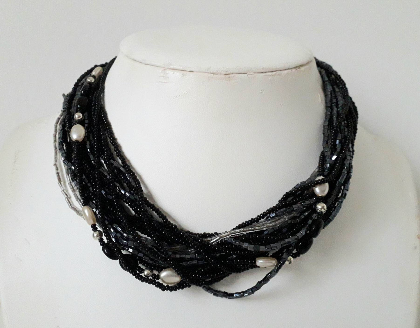 1960s black, clear and pewter coloured multi stranded glass bead necklace