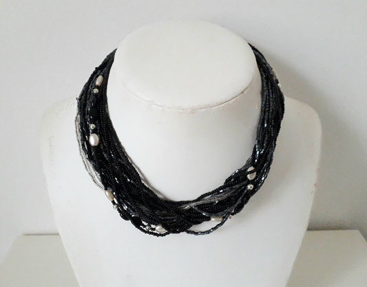 1960s black, clear and pewter coloured multi stranded glass bead necklace
