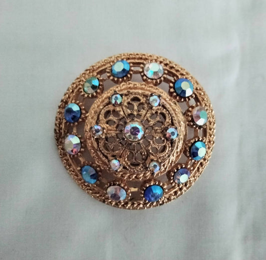 1950s goldtone & blue aurora borealis rhinestone large circular brooch