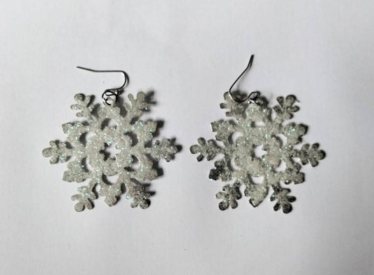 White & blue glitter snowflake dangly winter earrings