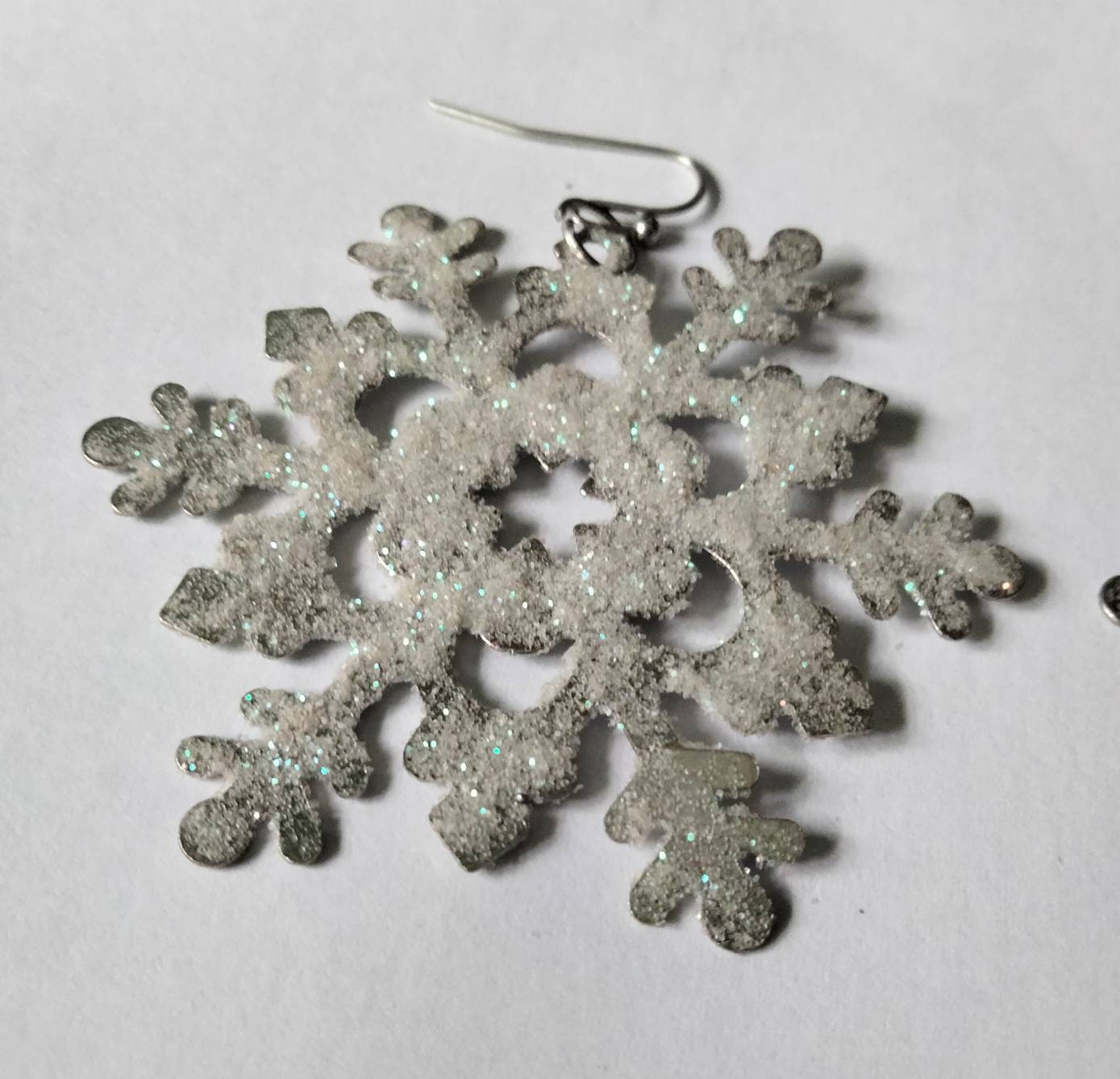 White & blue glitter snowflake dangly winter earrings