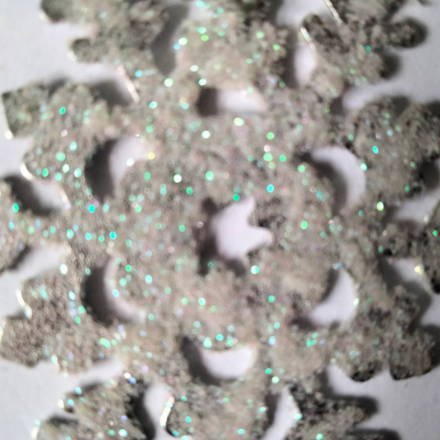 White & blue glitter snowflake dangly winter earrings