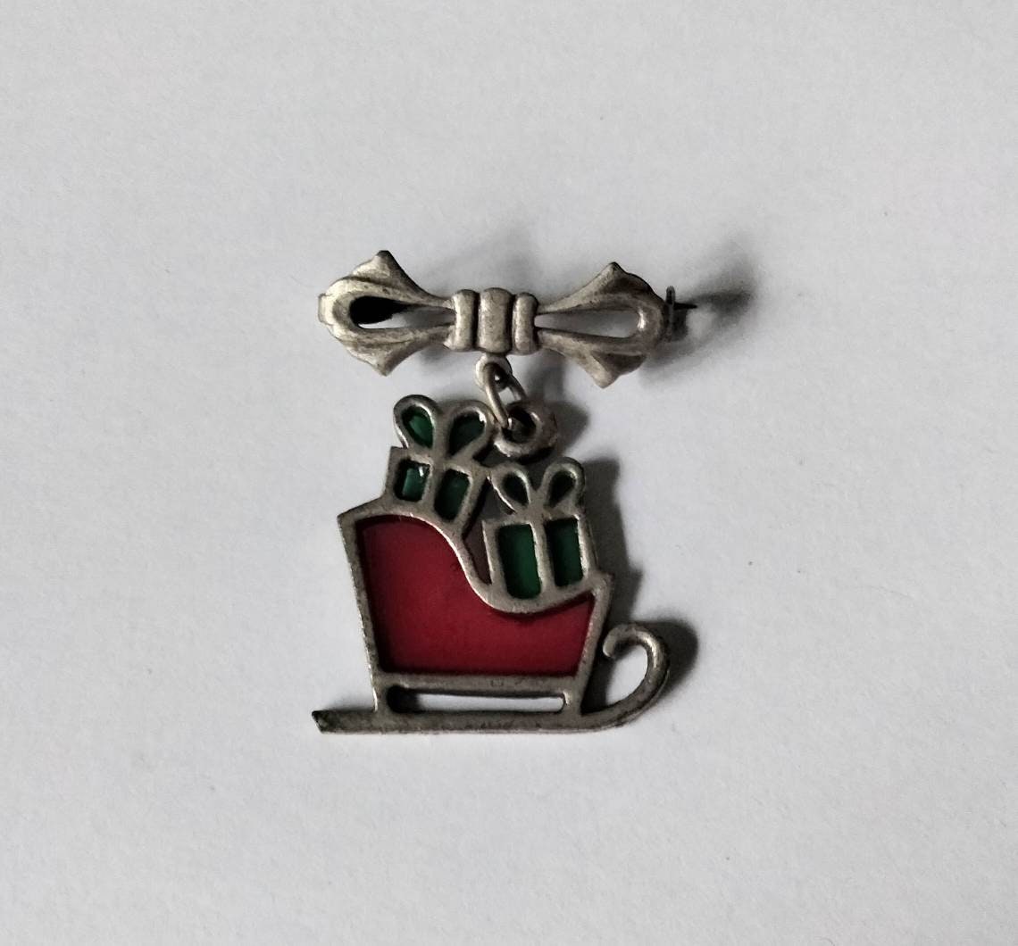 1980s red stained glass Christmas presents on sleigh brooch