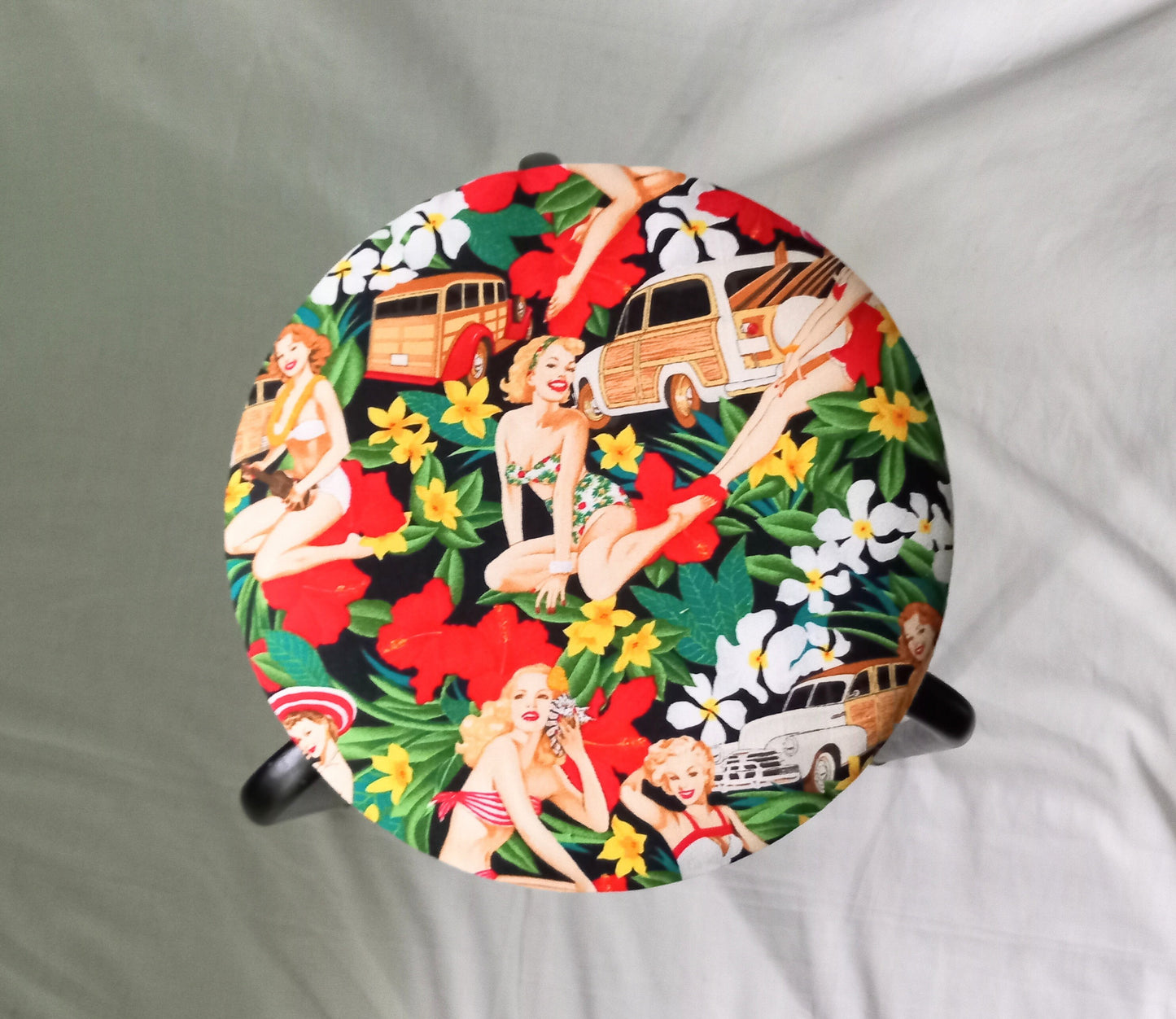 Mid century small stool reupholstered with red Hula Girls pin up girl fabric