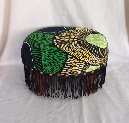 Vintage foot stool reupholstered with green & yellow African tribal print fabric
