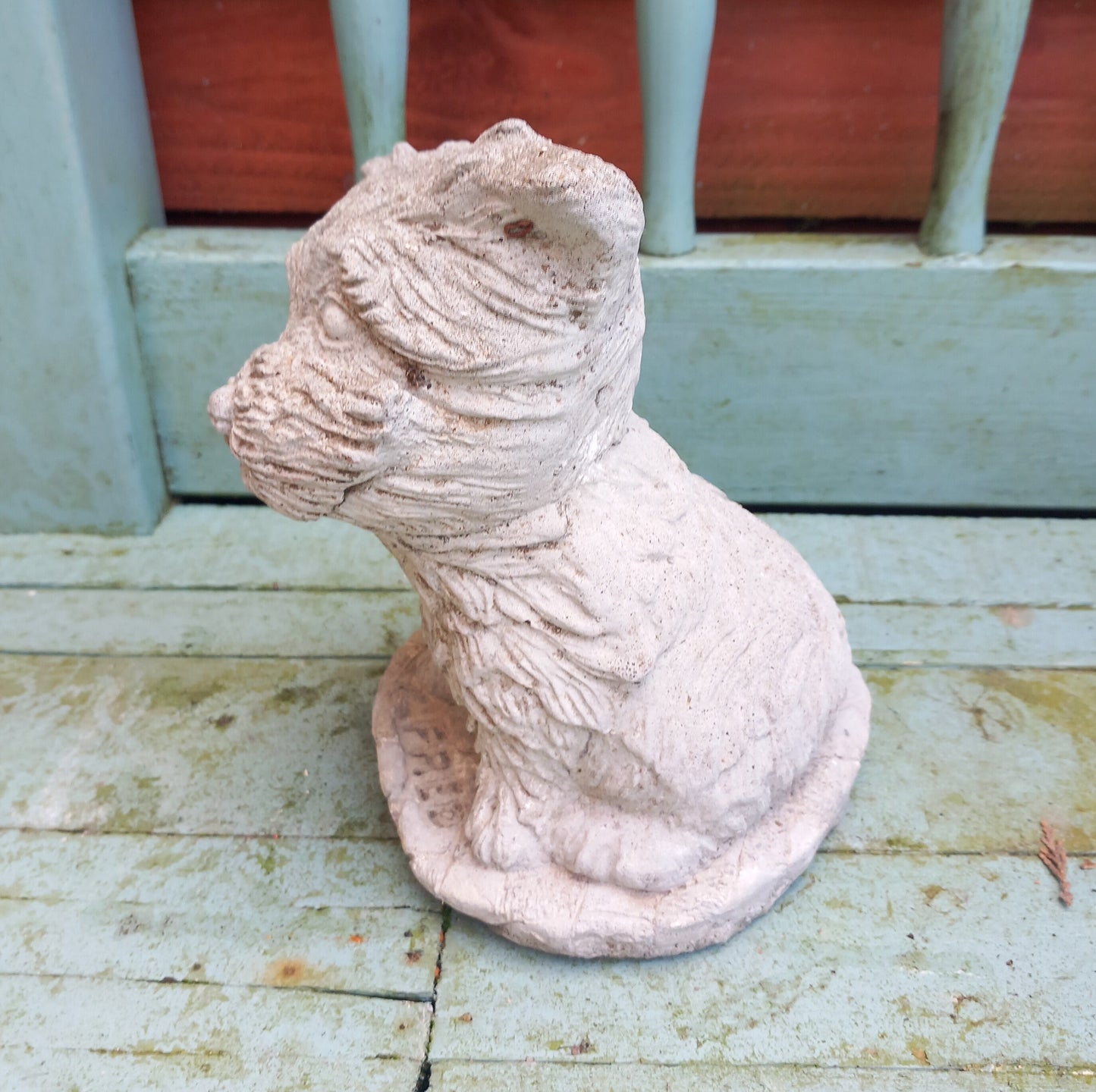 Vintage concrete garden statue of a terrier dog