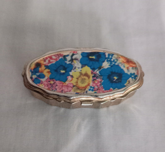 Mid Century Goldtone Pill Pot Sewing Kit With Pink, Blue & Yellow Flower Design