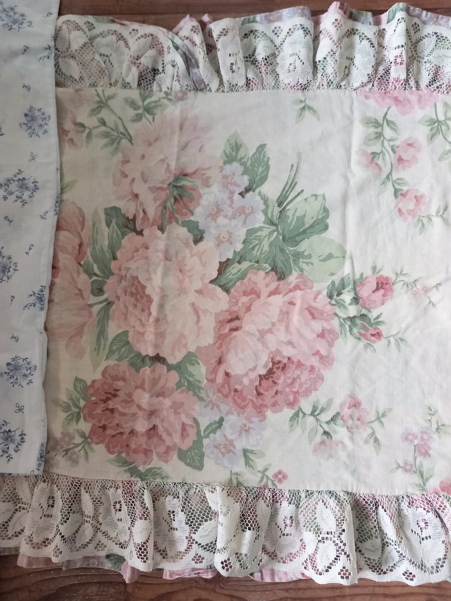 Four 1980s pillowcases in pink and blue with floral prints