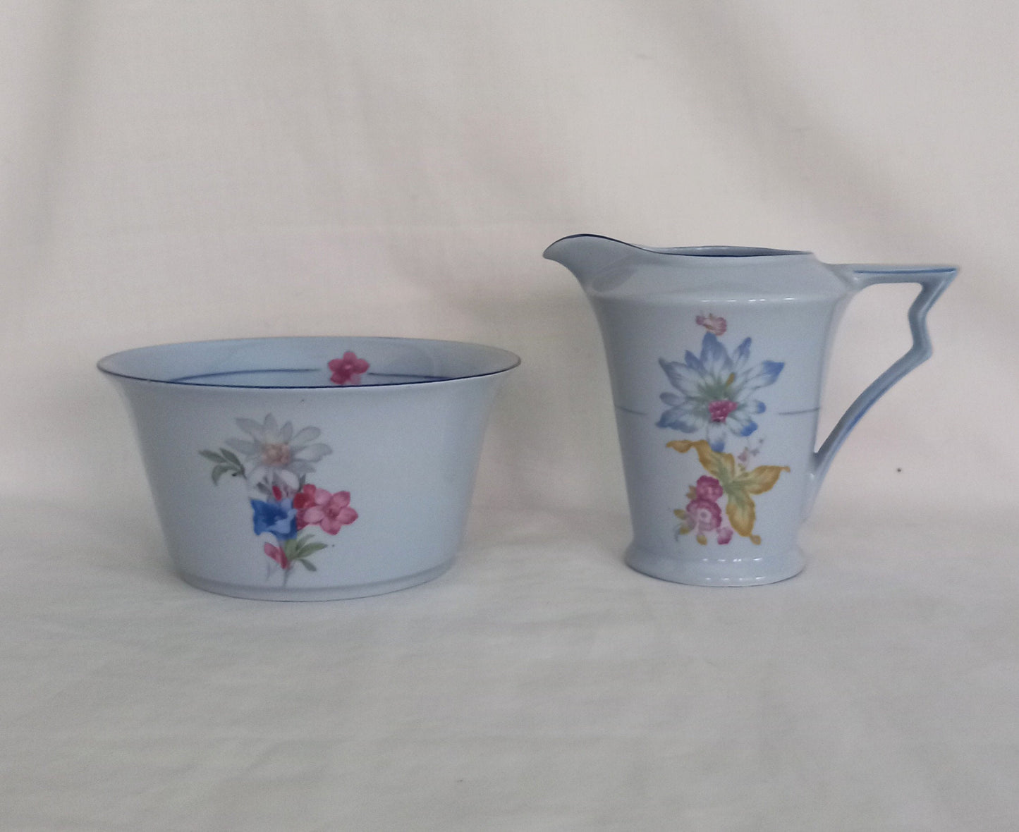 Art Deco blue cream jug and sugar bowl set with flower pattern