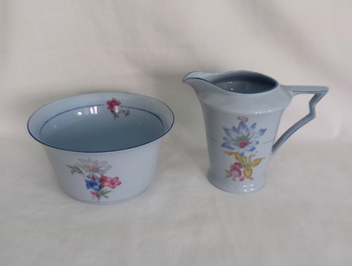 Art Deco blue cream jug and sugar bowl set with flower pattern