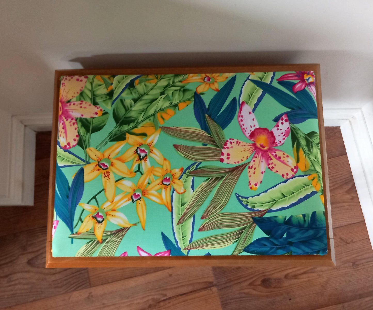 Mid century storage stool reupholstered in blue & pink tropical flower print fabric