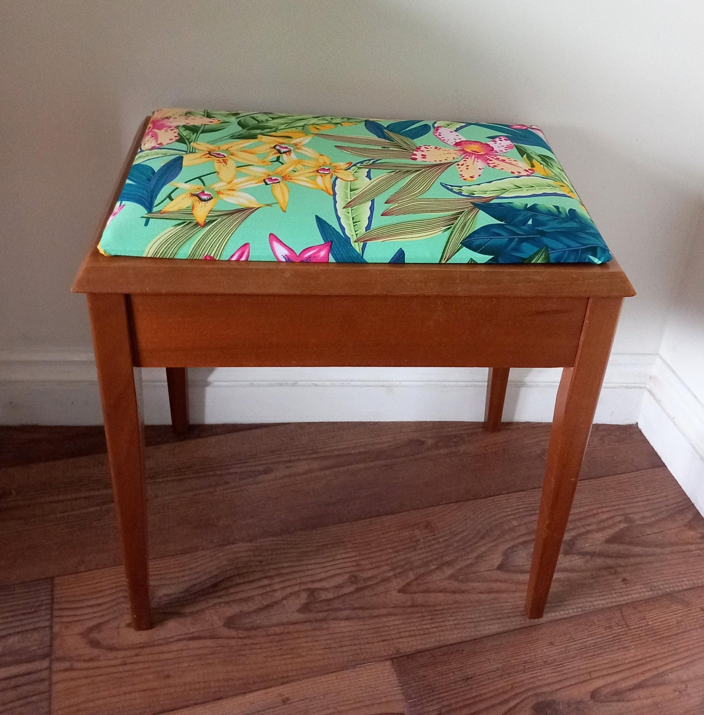Mid century storage stool reupholstered in blue & pink tropical flower print fabric