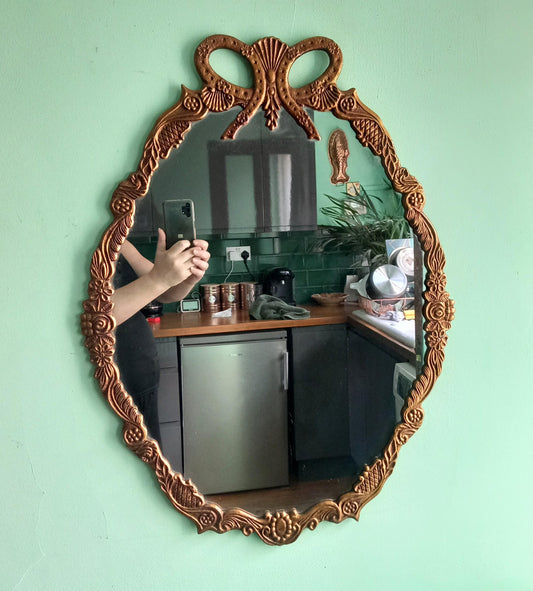 1970s Rococo style bow design cast metal gilt wall mirror 27.5"