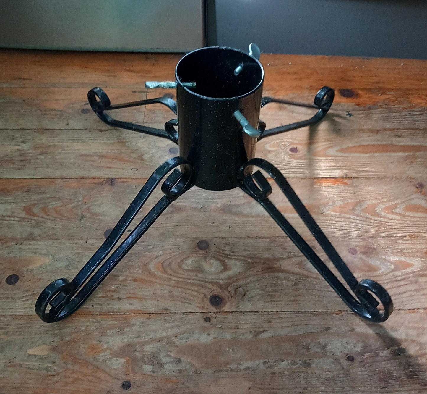 Black curled wrought iron Christmas tree stand