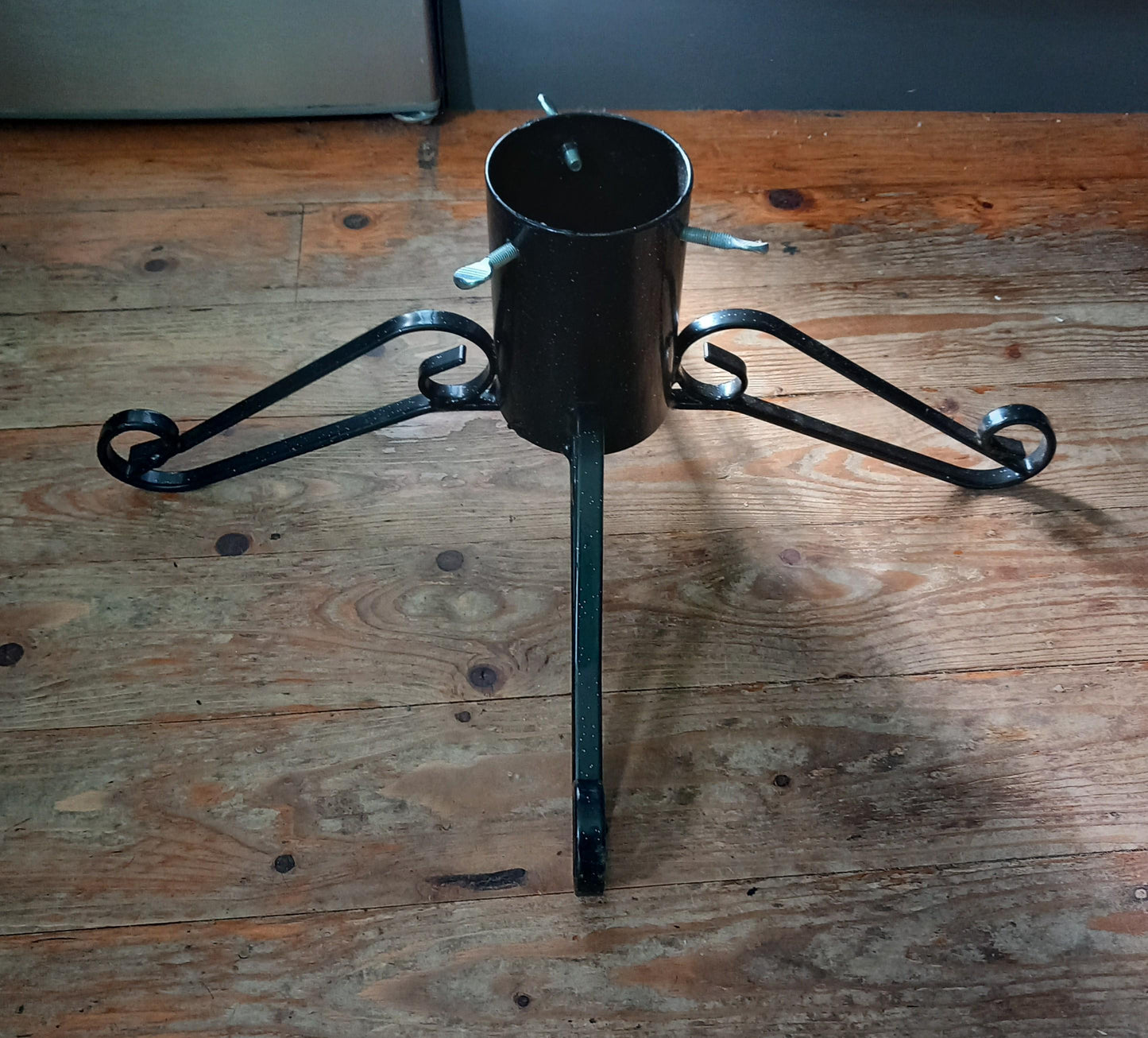 Black curled wrought iron Christmas tree stand