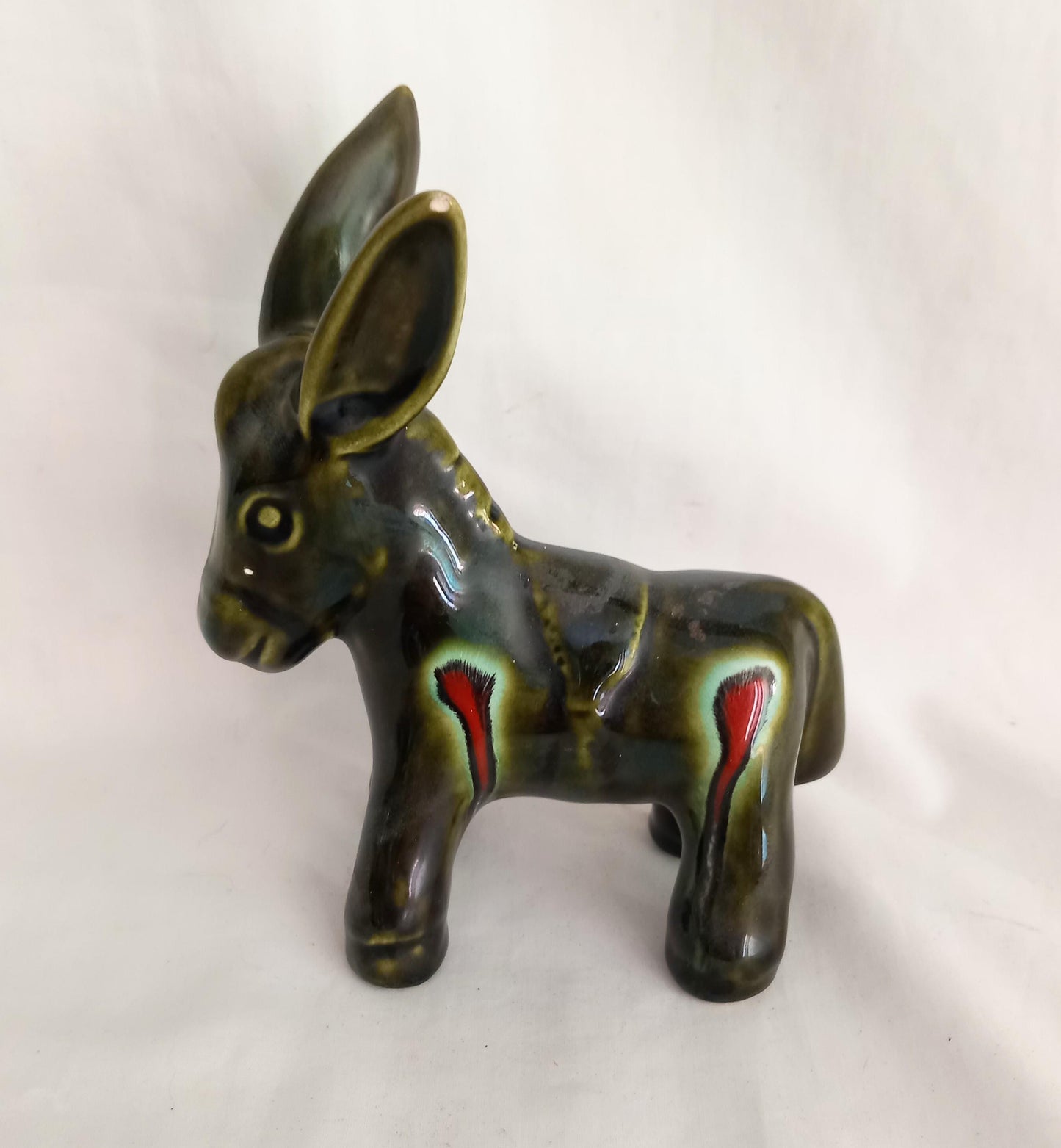 Mid century green and red lava glaze donkey statue