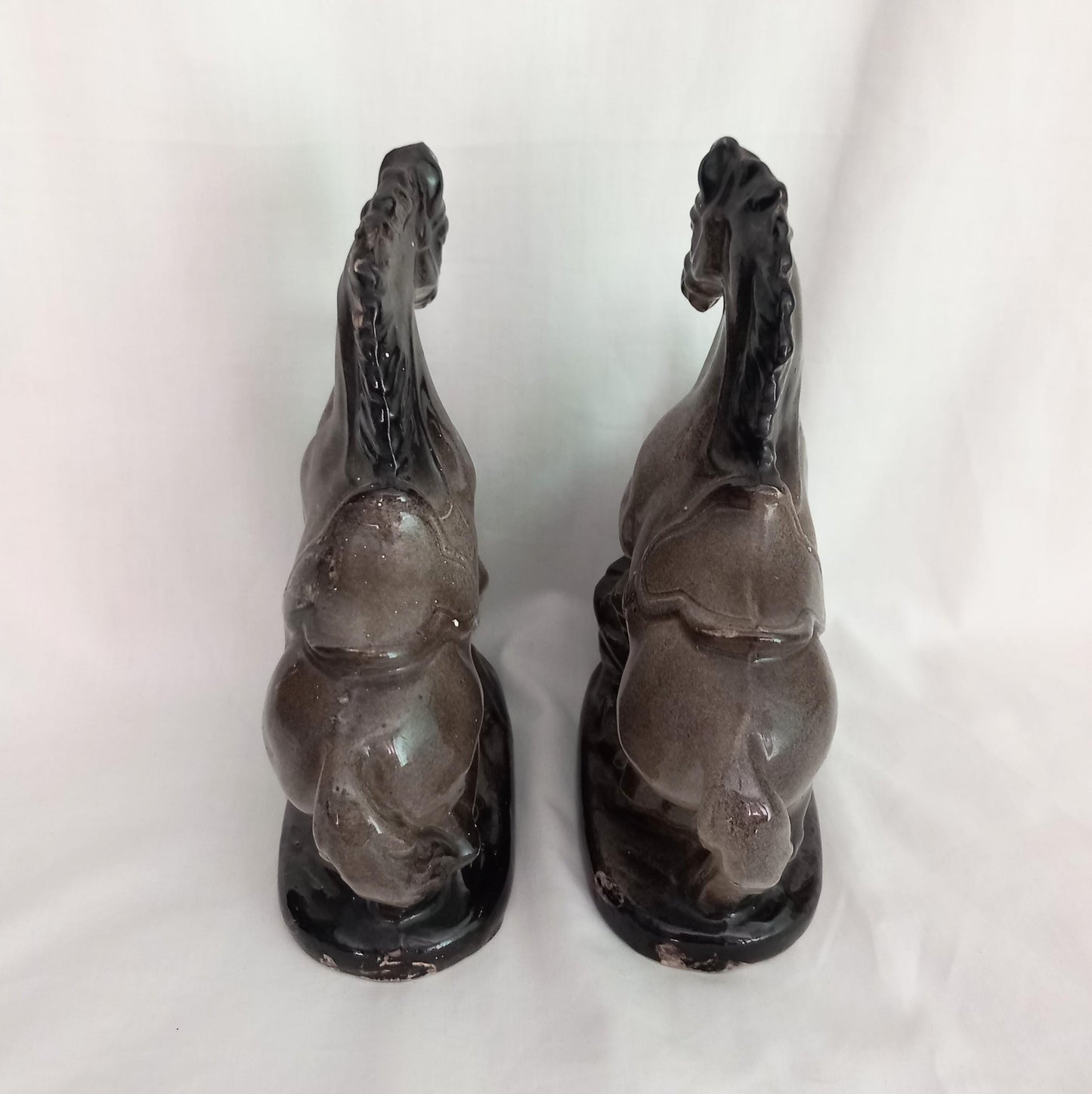 Mid Century pair of ceramic rearing horse statues
