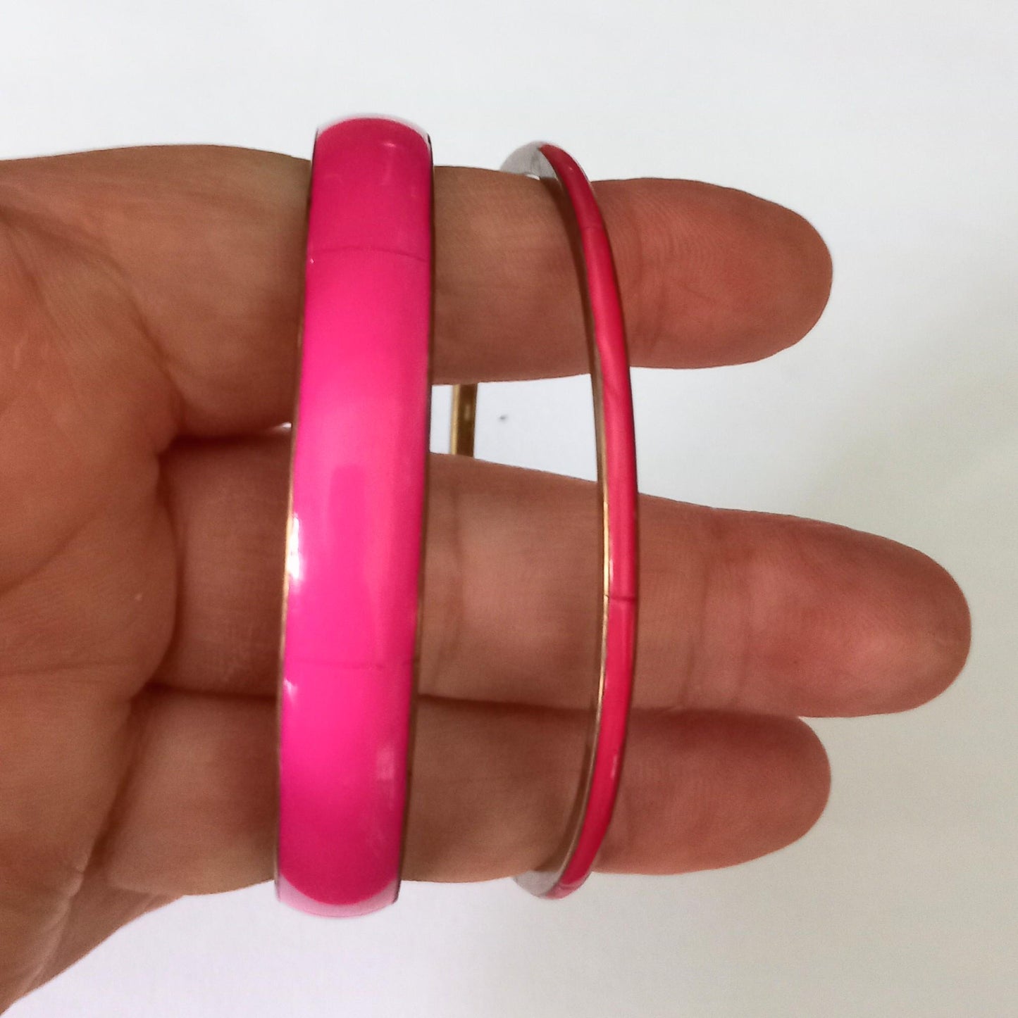 Vintage pair of brass and pink bangle bracelets