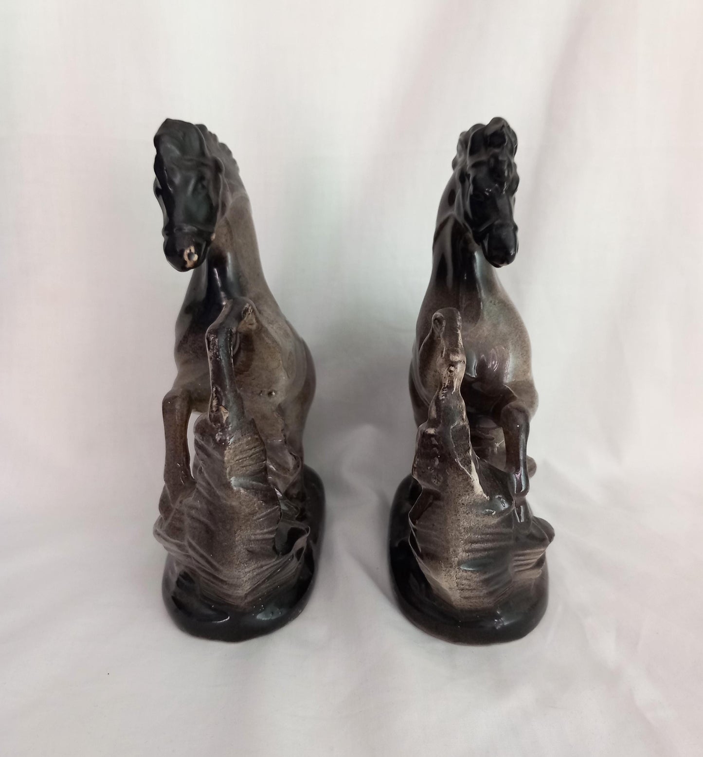 Mid Century pair of ceramic rearing horse statues