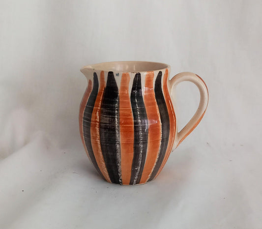 Mid Century studio pottery jug with orange and black striped glaze
