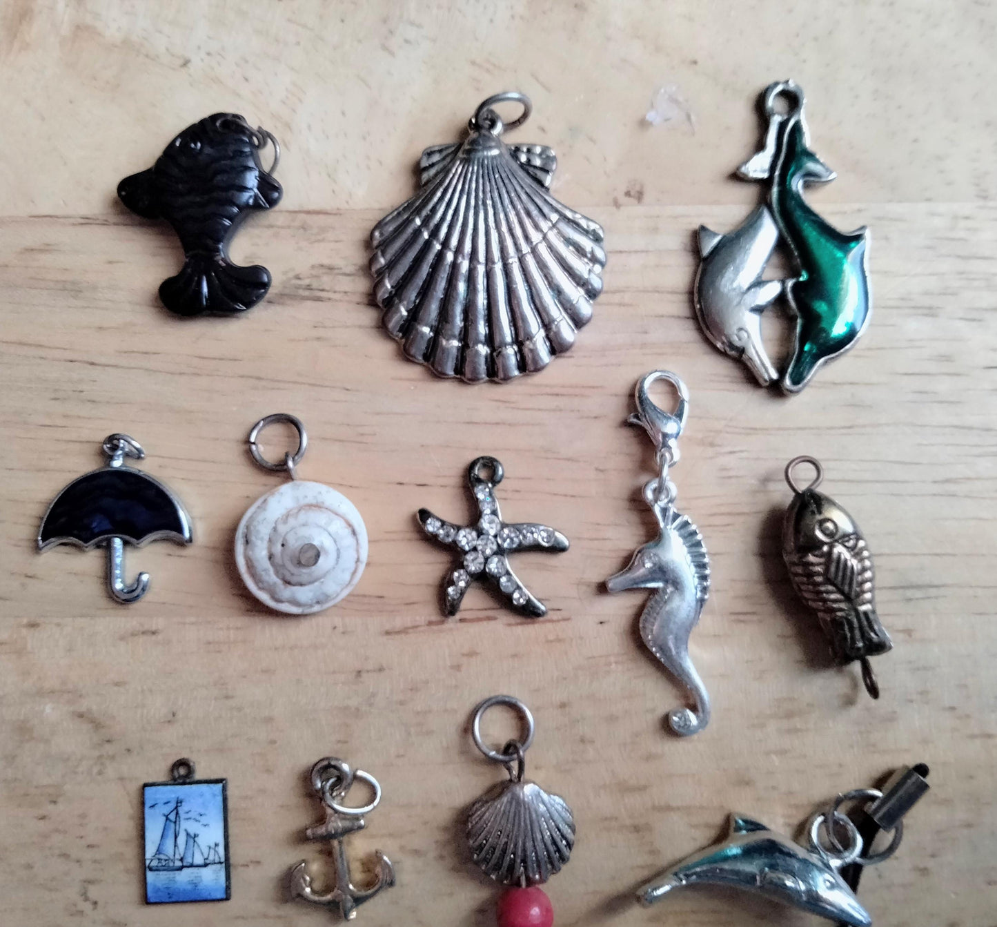 Lot of 14 seaside and sealife pendants and charms including fish, shells, anchor and starfish