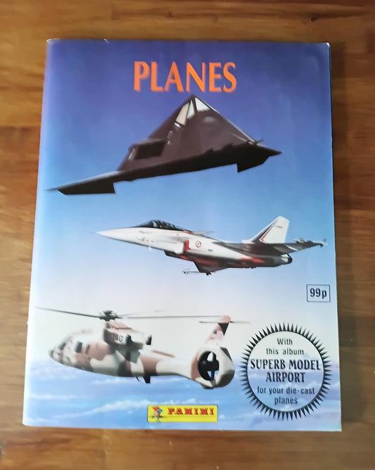 1990s Panini Planes sticker album approximately 75% full