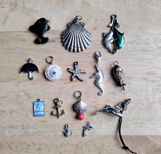 Lot of 14 seaside and sealife pendants and charms including fish, shells, anchor and starfish