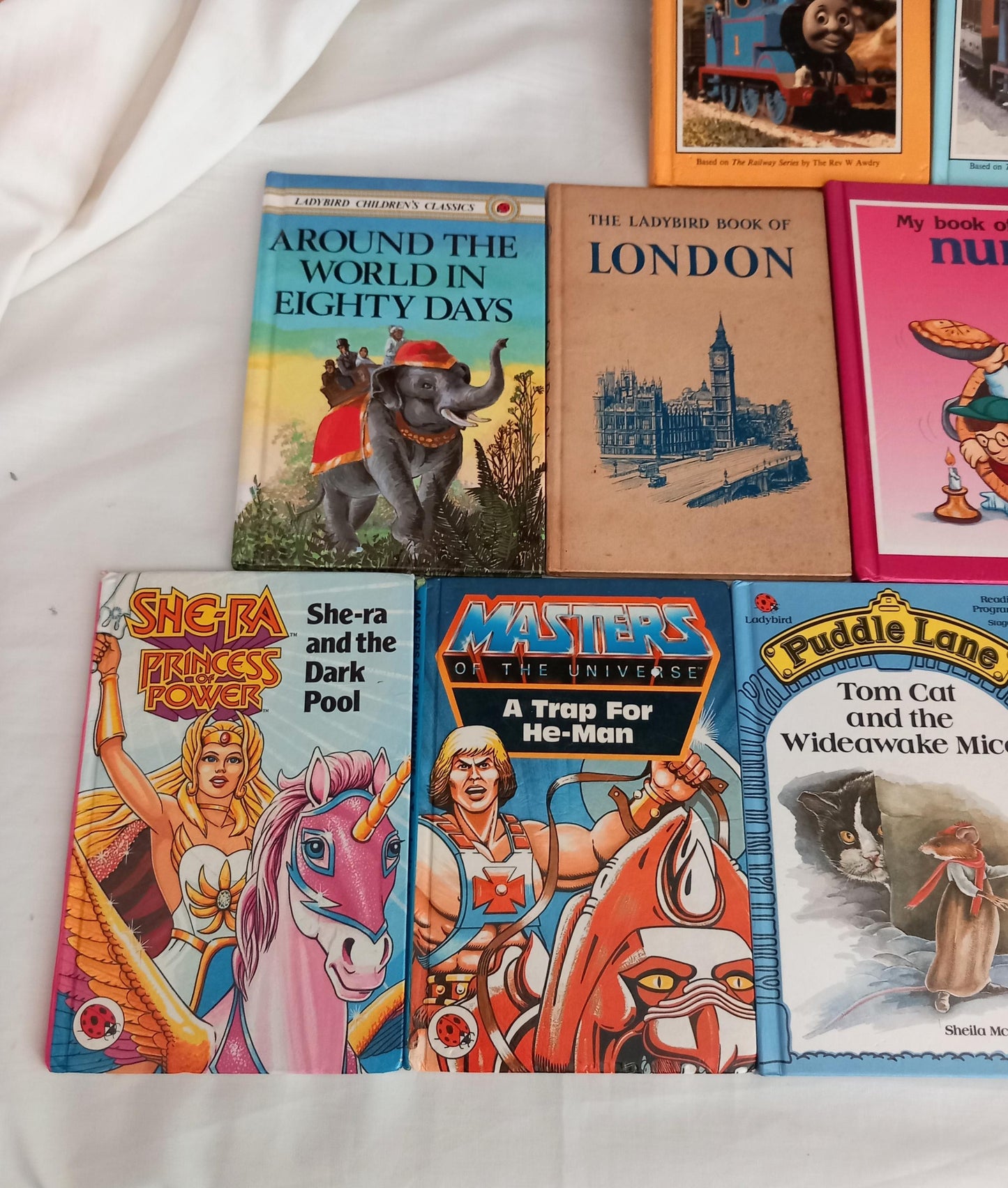 Bundle of 1980s Ladybird books including Puddle Lane, Thomas The Tank Engine, She Ra and He Man