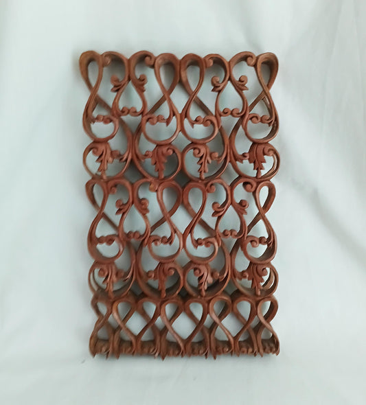 Intricately carved ethnic wooden curved pattern wall plaque