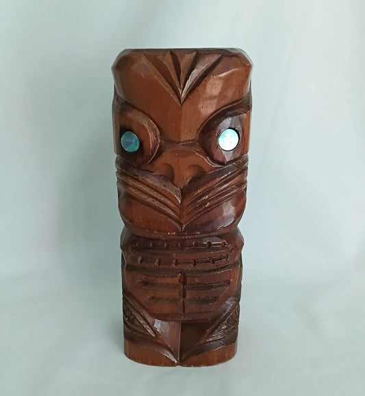 Hand carved wooden Tiki style statue set with abalone shell